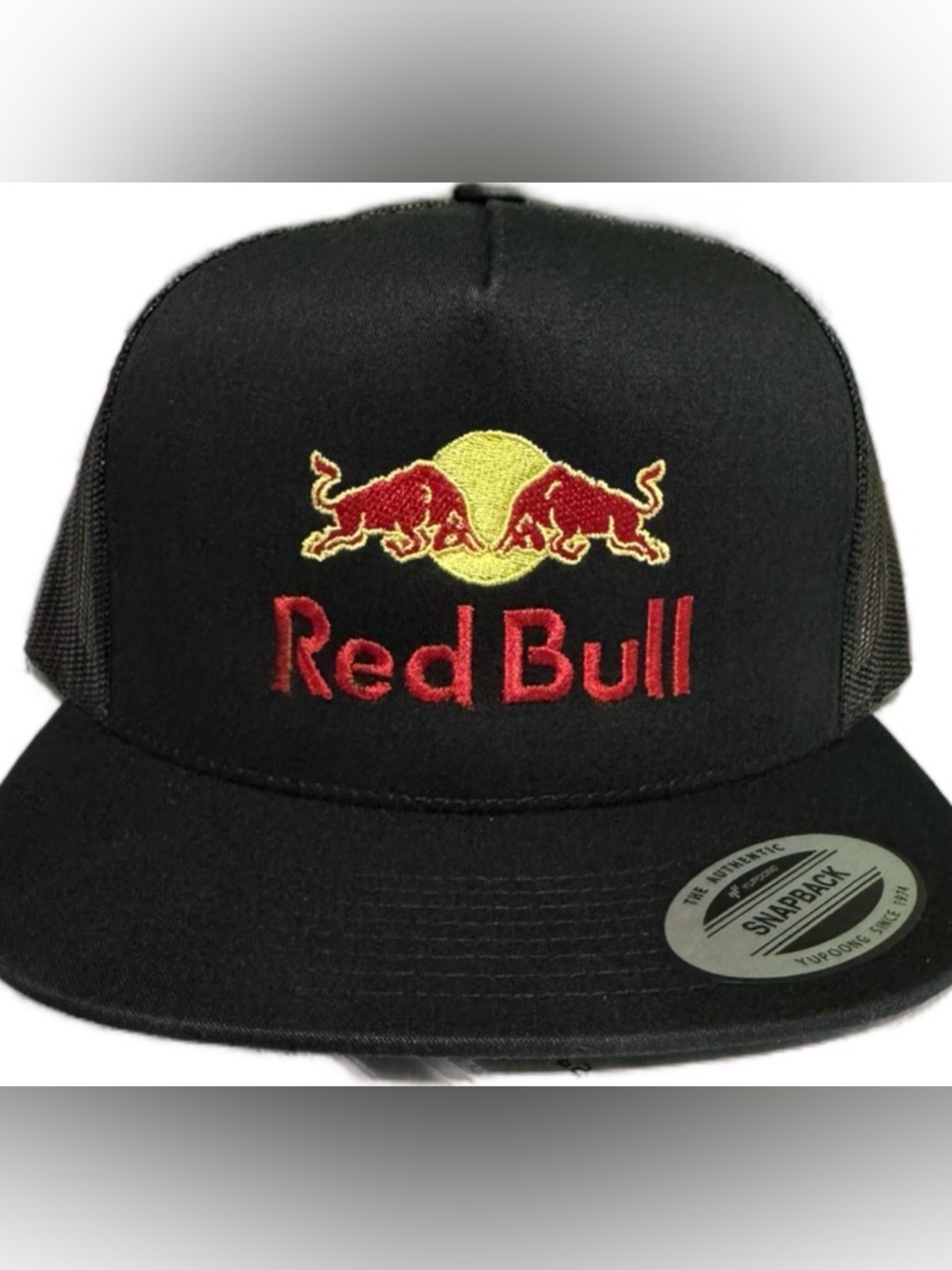 Flat Bill Red Bull on a Mesh Snapback Trucker Hat Cap